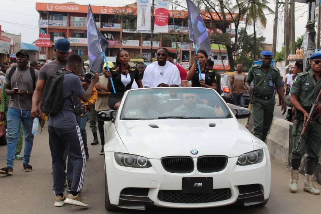 Club members gathered around their cars at a meet